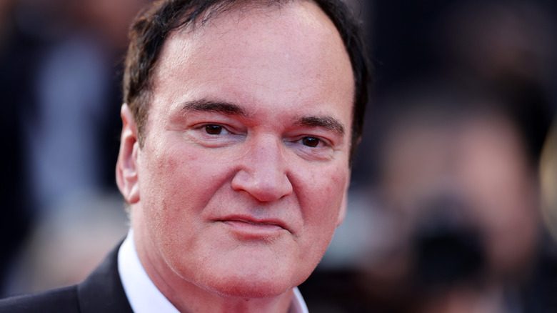 Quentin Tarantino in black suit